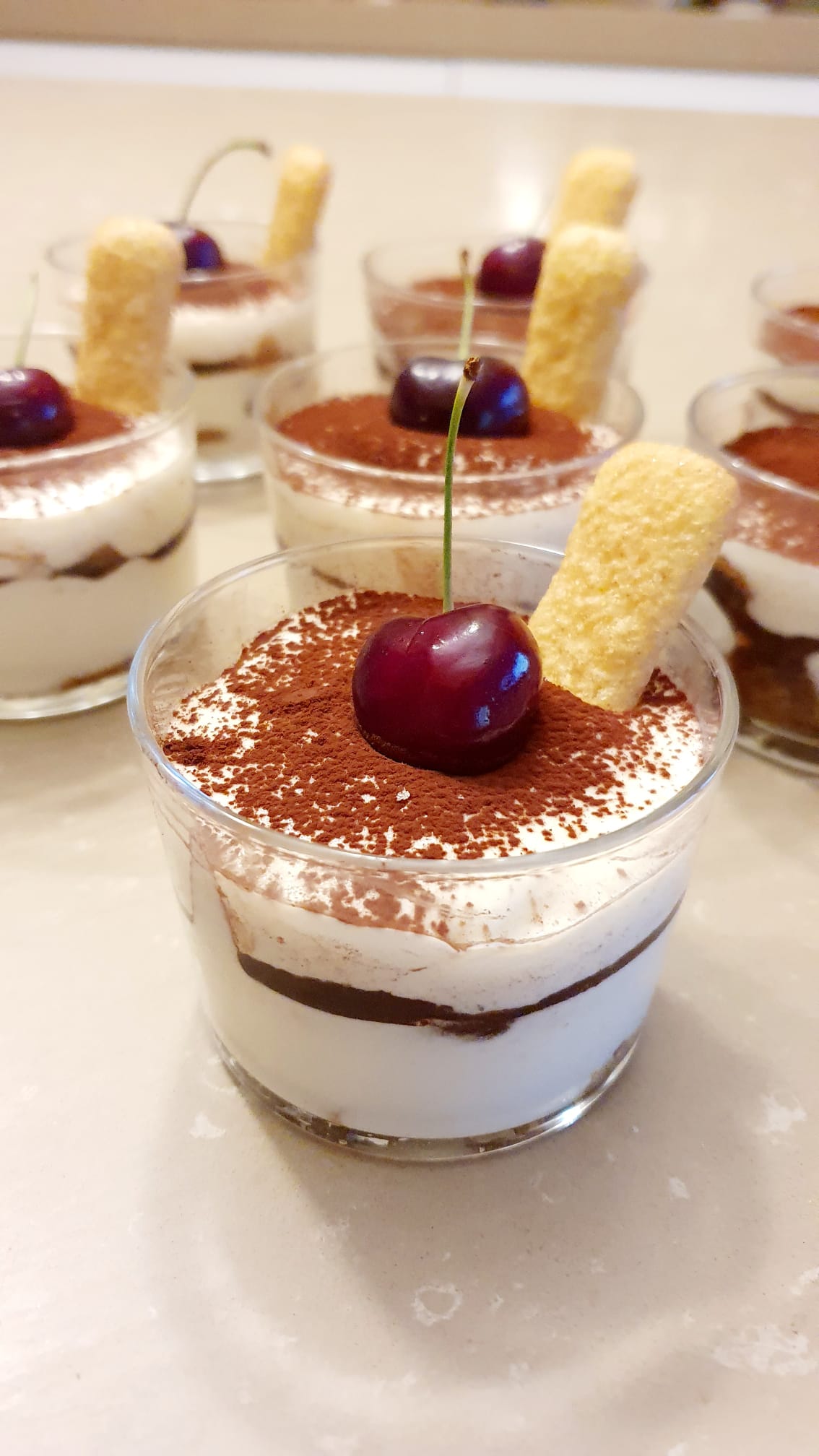 Individual tiramisu desserts prepared by Chef in Tuscany