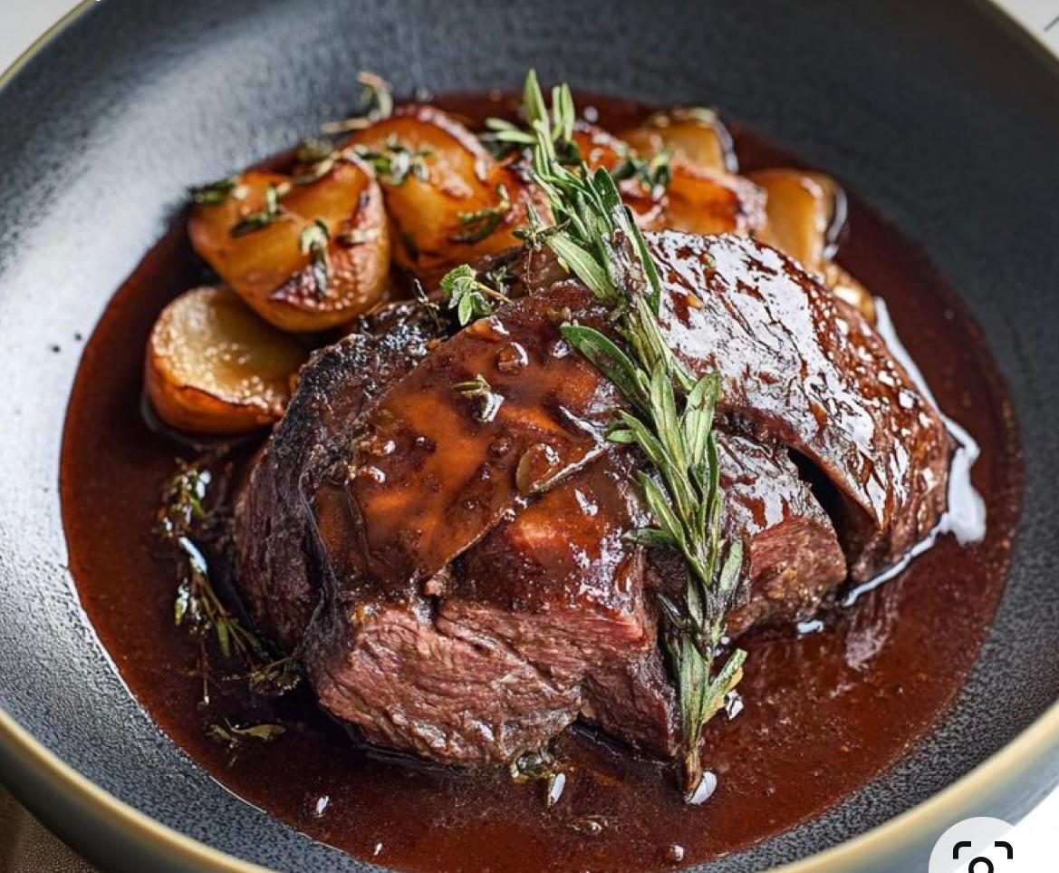 Roasted meat main course served during a Chef at Home dinner in Tuscany