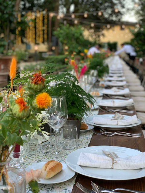 Outdoor dining scene styled for a Tuscan celebration