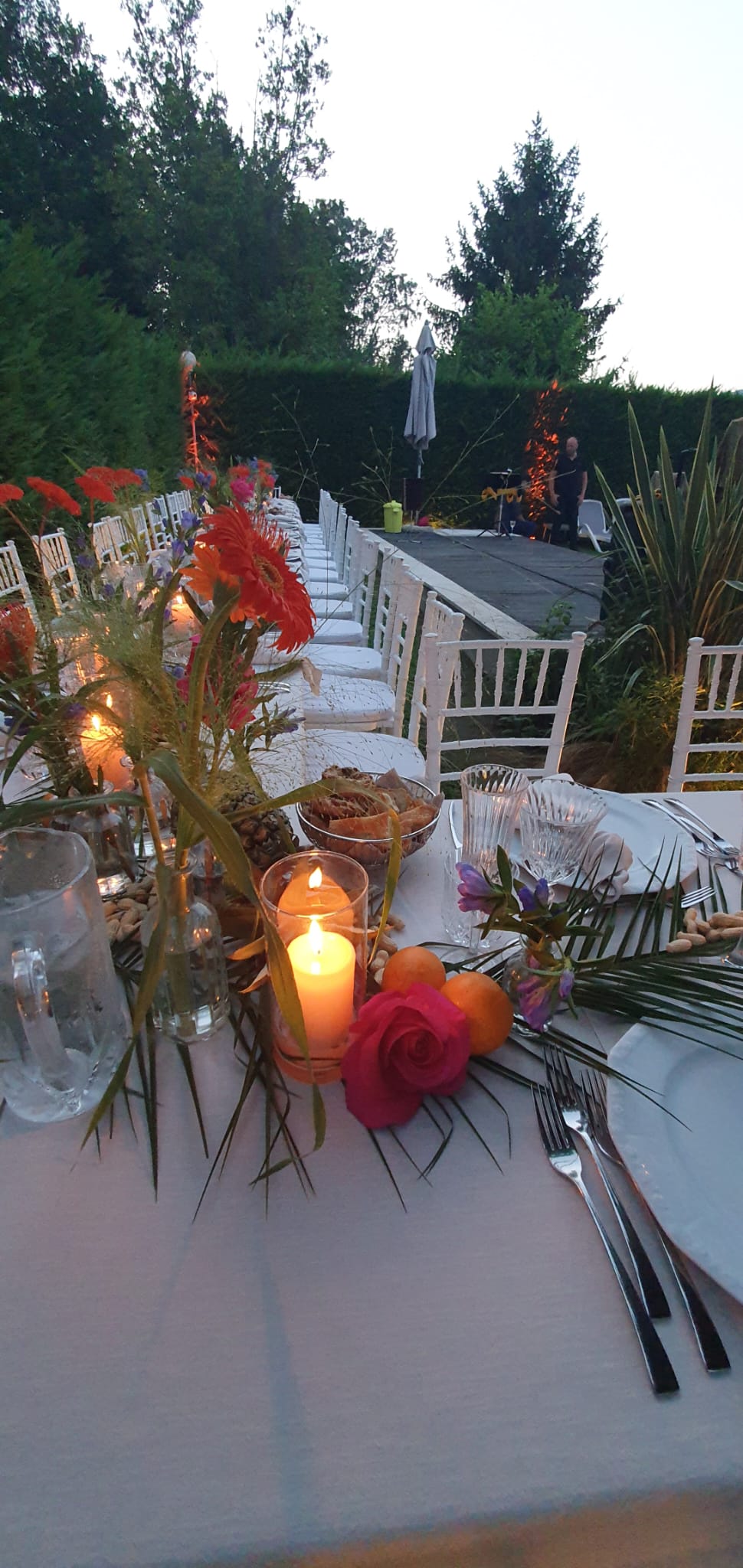 Styled event corner with floral accents and elegant tableware