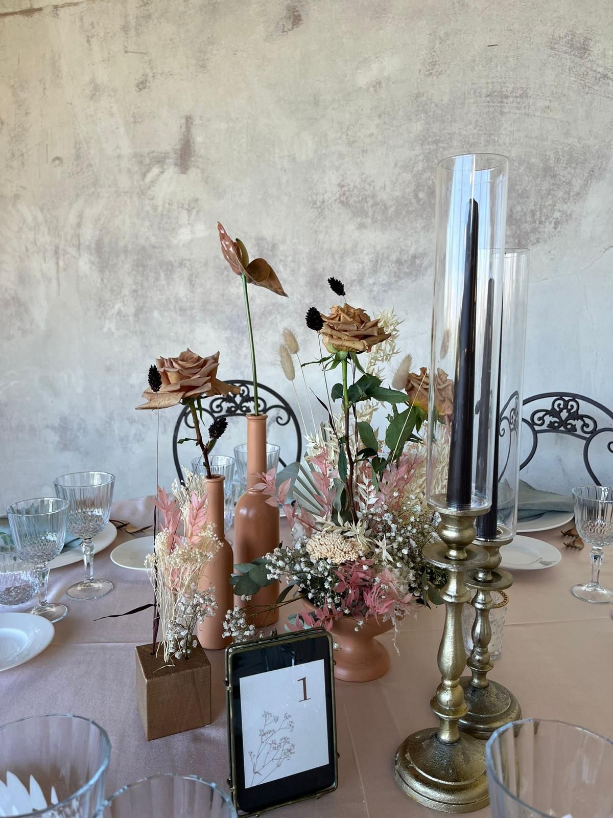 Colorful flower arrangement and glassware on a Tuscan table