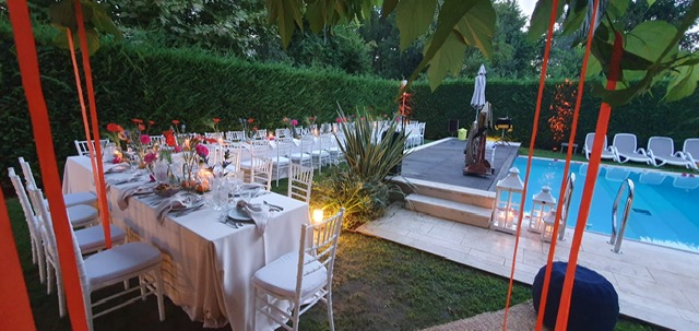 Outdoor dinner arrangement near the pool for a private celebration